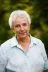 A headshot of Diana Lloyd against a green garden background