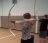 A young person pointing a bow and arrow to the left.