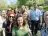 Group of people outside, smiling in the sun