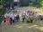 Team of people in a garden holding giant ballons that spell out 40M