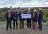 The Foundation and MM Wealth teams stood together with a panorama of Cambridge in the background. A cheque for £7,500 is being handed over.